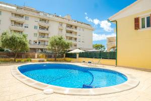 a large swimming pool in front of a building at Villa Tucan Alcudia Cycling in Alcudia