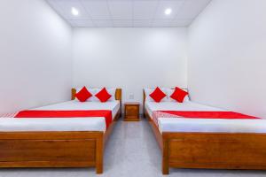 Giường trong phòng chung tại OYO 745 Minh Duc Guest House