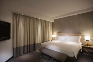 Krevet ili kreveti u jedinici u objektu Gateway Hotel, Marco Polo