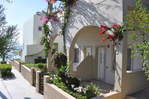 a building with flowers on the side of it at Haraki Village in Haraki