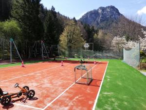 a tennis court with a net on top of it at Hotel Seeblick in Bad Reichenhall