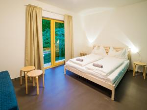 Postel nebo postele na pokoji v ubytování Hostel Zahrada Mikulov