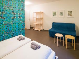 Postel nebo postele na pokoji v ubytování Hostel Zahrada Mikulov