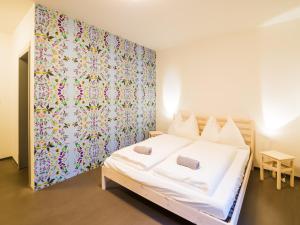 Postel nebo postele na pokoji v ubytování Hostel Zahrada Mikulov