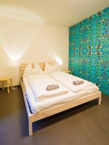 Postel nebo postele na pokoji v ubytování Hostel Zahrada Mikulov