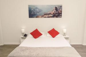 
Cama ou camas em um quarto em CLH Suites Domingos Ferreira
