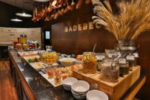 
a kitchen filled with lots of different types of food at Radisson Vila Olimpia Sao Paulo in São Paulo
