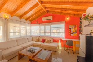 a living room with a couch and a table at Elisavet Apts in Kavos