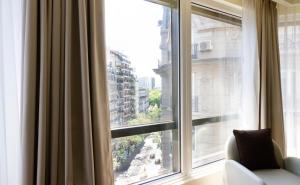 a large window with a view of a city at Park Royal City Buenos Aires in Buenos Aires