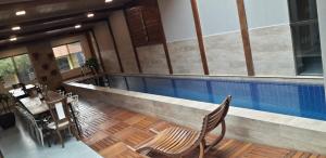 an overhead view of a swimming pool in a house at Tapindaré Hotel in Alto Paraíso de Goiás +26 photos