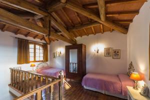 Giường trong phòng chung tại Poggio d'Oro