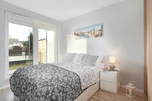 Posteľ alebo postele v izbe v ubytovaní Elite Apartments Marine Suite