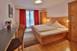 Postel nebo postele na pokoji v ubytování Hotel Pension Geiger