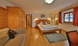 Postel nebo postele na pokoji v ubytování Hotel Pension Geiger