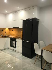 Kuchyňa alebo kuchynka v ubytovaní Apartament Przy Promenadzie