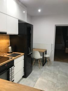 Kuchyňa alebo kuchynka v ubytovaní Apartament Przy Promenadzie