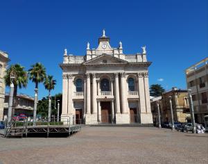 a building with a clock tower on top of it at Casa Mia Apartment in Riposto +12 photos