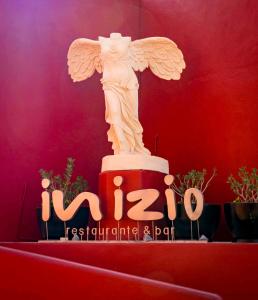 a statue of an angel sitting on top of a table at Club Regina Los Cabos in San José del Cabo