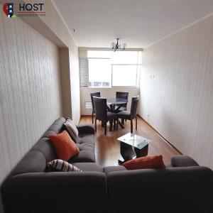 a living room with a couch and a table at Host - San Isidro Sta Catalina in Lima +6 photos