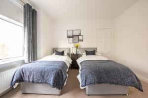 Voodi või voodid majutusasutuse PREMIER - Dalziel Apartment toas