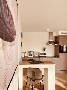 A cozinha ou cozinha compacta de Luxury Apartment Mons City Center