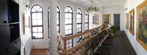 a hallway with a staircase in a building with windows at Wytchnienie in Lublin