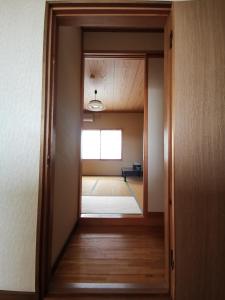 Postel nebo postele na pokoji v ubytování たから温泉民宿 Gem Onsen Stay
