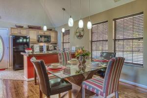 a kitchen with a dining room table and chairs at Daya in Gatlinburg