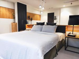 Postel nebo postele na pokoji v ubytování Roppongi Motel