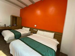 Ένα ή περισσότερα κρεβάτια σε δωμάτιο στο Lorna Resort