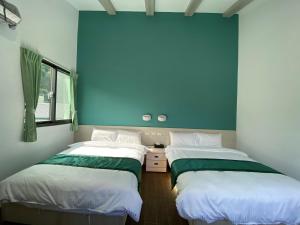 Ένα ή περισσότερα κρεβάτια σε δωμάτιο στο Lorna Resort