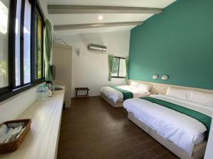 Ένα ή περισσότερα κρεβάτια σε δωμάτιο στο Lorna Resort