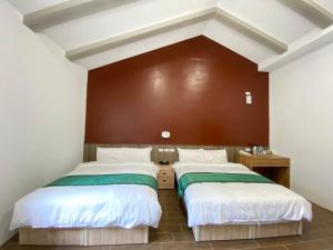 Ένα ή περισσότερα κρεβάτια σε δωμάτιο στο Lorna Resort