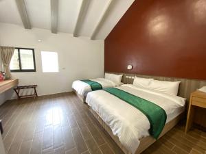 Ένα ή περισσότερα κρεβάτια σε δωμάτιο στο Lorna Resort
