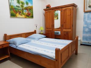 Voodi või voodid majutusasutuse Hotel CHEZ PAPA DAYA toas