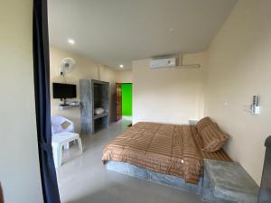 Postel nebo postele na pokoji v ubytování Budchui Guesthouse