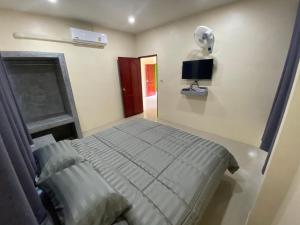 TV a/nebo společenská místnost v ubytování Budchui Guesthouse