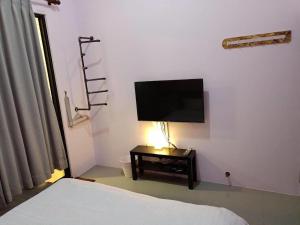 Sjónvarps- og/eða afþreyingartæki á 東立方旅宿-East Cube B&B