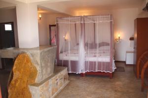 Postel nebo postele na pokoji v ubytování Shanthi Beach Resort