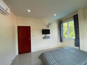 TV a/nebo společenská místnost v ubytování Budchui Guesthouse