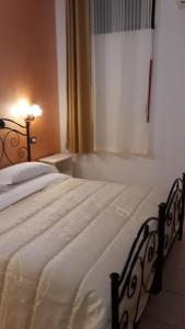 Postel nebo postele na pokoji v ubytování Il Rifugio dell'Ape Agriturismo
