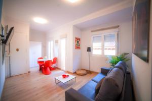 a living room with a couch and a table at Apartment Madrid-Chueca in Madrid