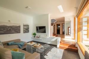 a living room with a couch and a table at Playa Blanca Beach Mate in Playa Blanca