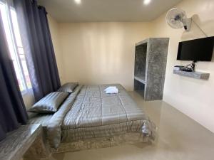 Postel nebo postele na pokoji v ubytování Budchui Guesthouse