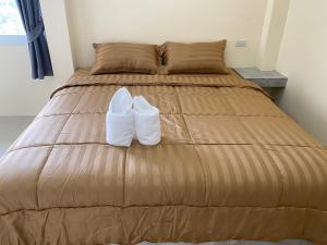 Postel nebo postele na pokoji v ubytování Budchui Guesthouse