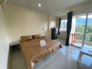 Postel nebo postele na pokoji v ubytování Budchui Guesthouse