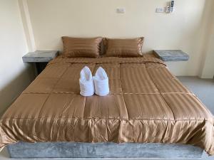 Postel nebo postele na pokoji v ubytování Budchui Guesthouse