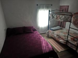 Łóżko lub łóżka w pokoju w obiekcie Maribella chambres à louer