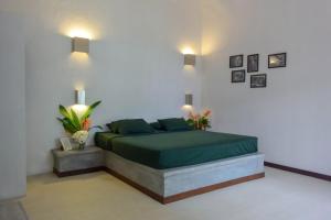 Postel nebo postele na pokoji v ubytování Eva Lanka Hotel - Beach & Wellness