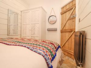 Säng eller sängar i ett rum på Beach Hut